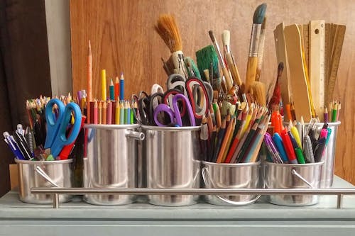 A bunch of art supplies on a table