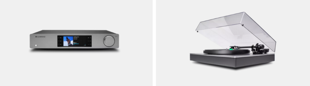 a silver turntable and silver audio system on a white background