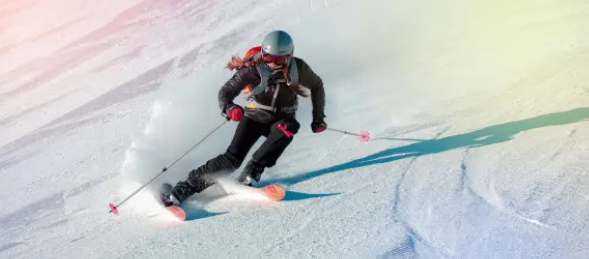 A woman skiing down one of the slopes at a Skiworld resort