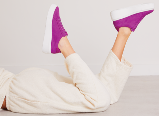 Carl Scarpa purple suede trainers and a cream track bottom