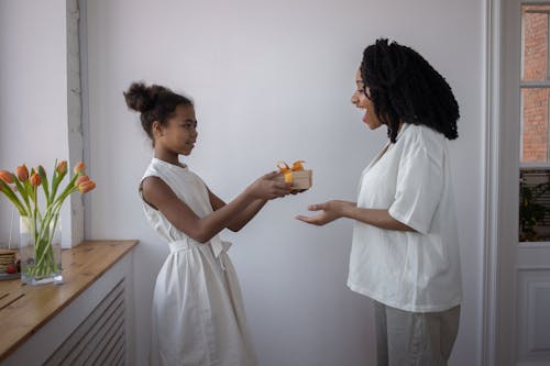 A child giving her mother a gift for Mother's Day