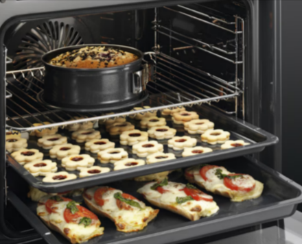 A 3000 SurroundCook Aqua clean enamel built-in oven from AEG with food