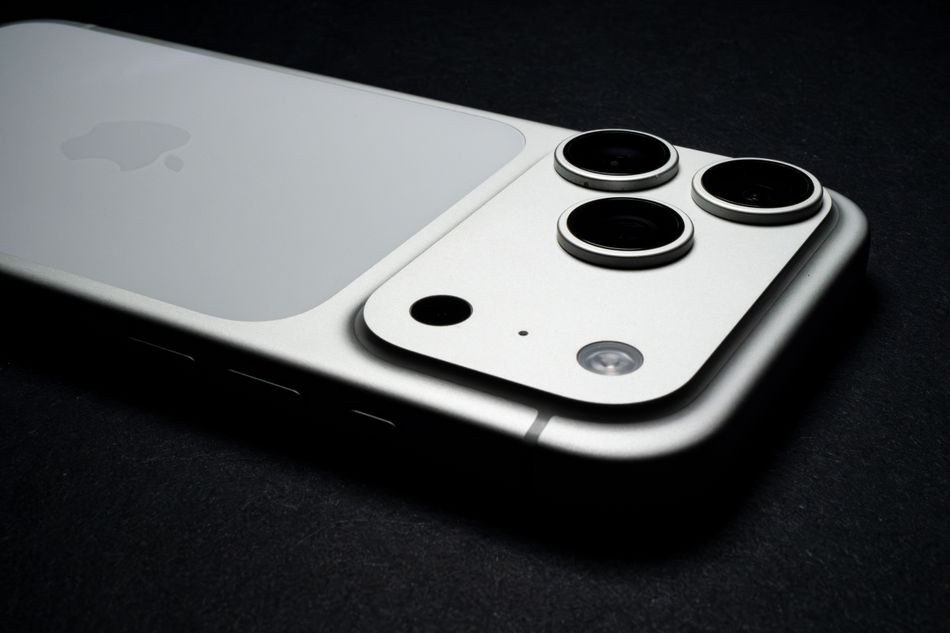 Detailed close-up of smartphone triple camera lenses on a sleek modern device