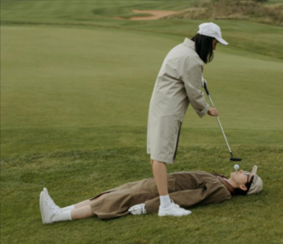 Man and woman playing golf