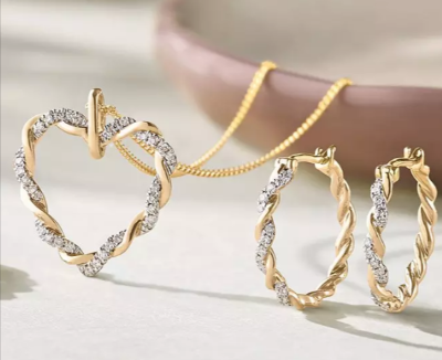 A jewellery set consisting of a gold and diamond necklace and earrings