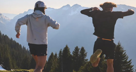 trail runners wearing teh ASICS apparel on a hill