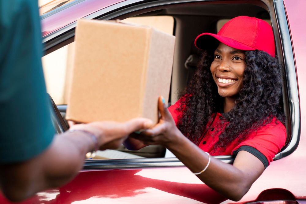 close-up-delivery-person-offering-parcel-client