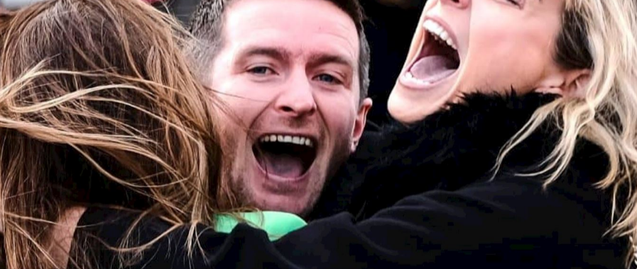 People celebrating at a race course