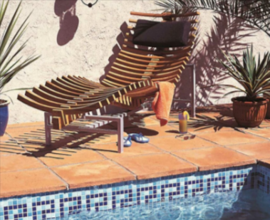 A pool with terracotta tiles from Gardenstone and a pool chair