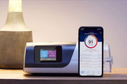 Intus Healthcare CPAP machine with smartphone displaying sleep therapy results