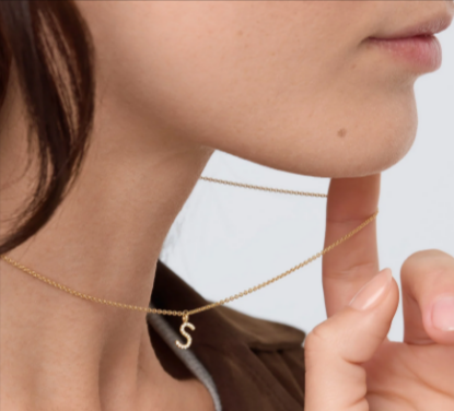 A Kimai yellow gold momento necklace