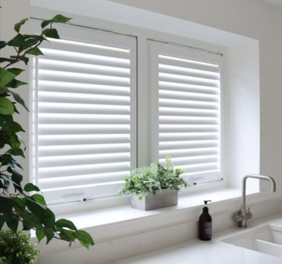 White blinds from Blindsbypost in a kitchen