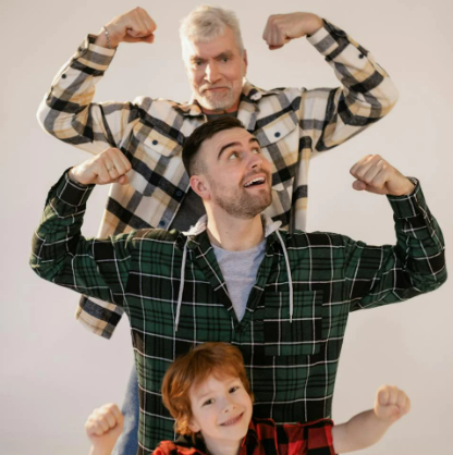 Three generations of a family showing off their muscles