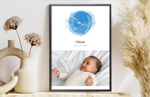 A CEWE frame with a baby picture on a living room desk