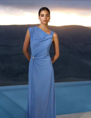 A woman wearing a French Connection Pascha jersey draped trim blue maxi dress
