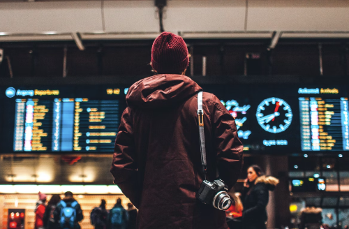 A male passenger with an upgraded ticket waiting for his flight 
