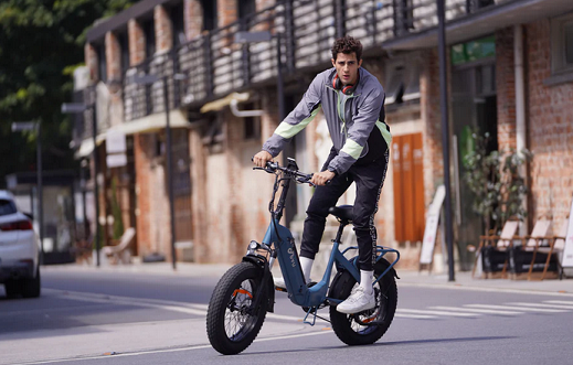image showing a DYU bike and it's owner
