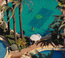 A shot of a vibrant tropical resort pool surrounded by palm trees booked through Holiday Extras