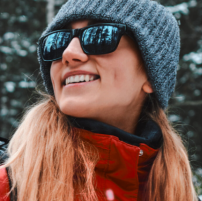 A woman wearing sunglasses from Boots bought with points from the Boots Advantage Card