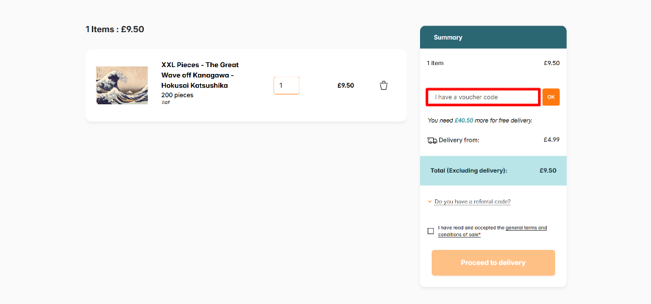The JigsawPuzzle order summary page with the discount code box highlighted with a red box