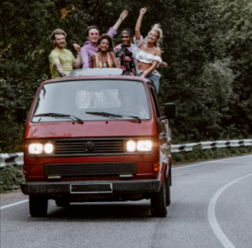 A diverse group of friends having fun on a shared shuttle booked through Holiday Taxis