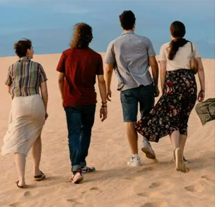 A group of friends taking a walk in the desert during a Exoticca trip