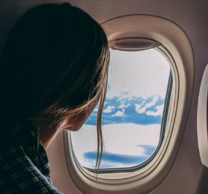 A lady on a flight on a business trip