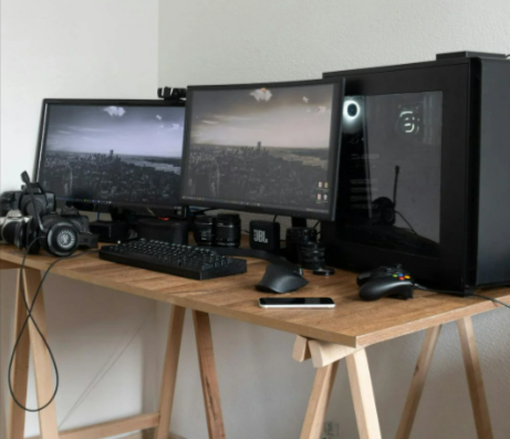 Photographer desk with monitors and gadgets