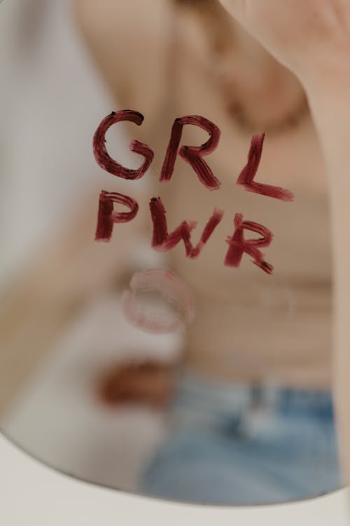 Girl power written on a mirror in lipstick