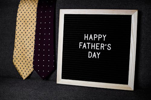 Two ties next to a sign saying Happy Fathers Day