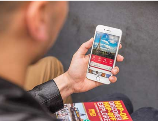 A person using the Big Bus Tours app
