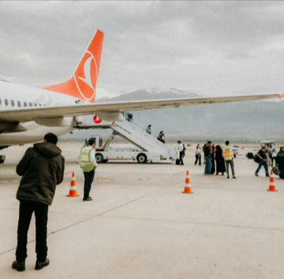 People disembarking a Turkish Airlines Airplane