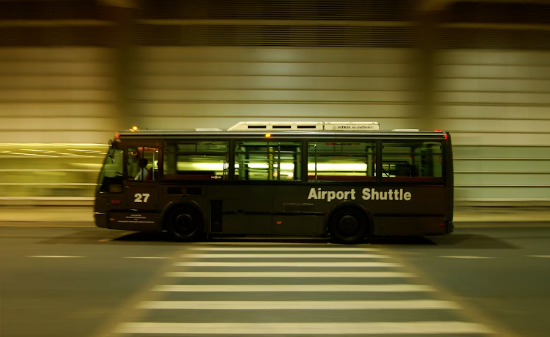 An airport shuttle bus enroute to drop off passengers