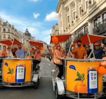 A Dash Water parade with friends sitting in the carts