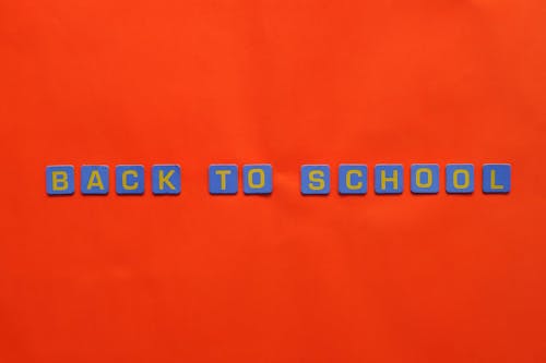 The letters "Back to School" arranged on a red background