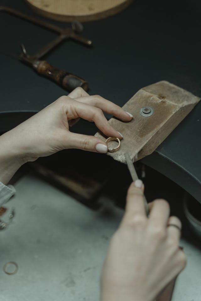 A person making a ring using products from Cooksongold