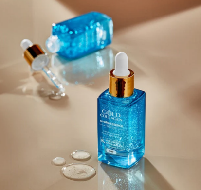 Two bottles of the Gold Collagen hydra essence serum