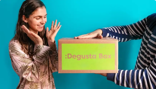 A person happy to be gifted a Degusta Box surprise gift