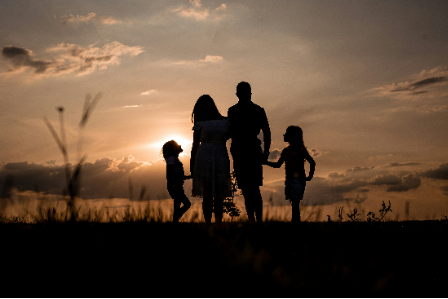 Findmypast ancentry check with a family looking far into the grass