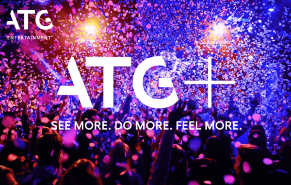A crowd at a concert with confetti and lights