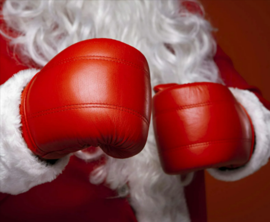 Santa Claus wearing boxing gloves