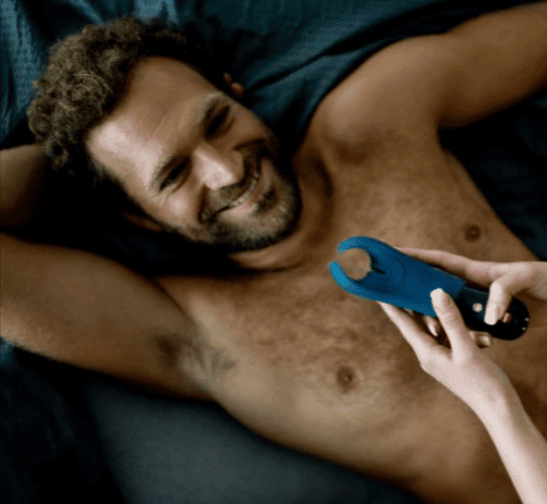 A couple using a sex toy that they saved on with a Harmony voucher code