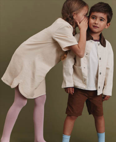 Two kids wearing clothes from the Falke kids section