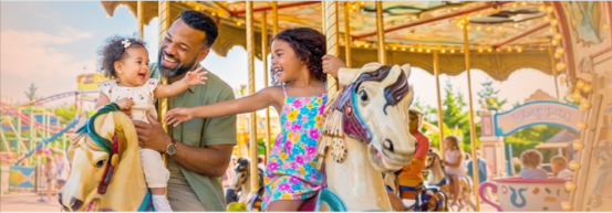 A family enjoying an amusement park that they saved on with a Groupon discount code
