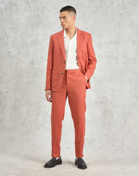 Wedding guest suits: A model wearing a blazer and trouser suit set