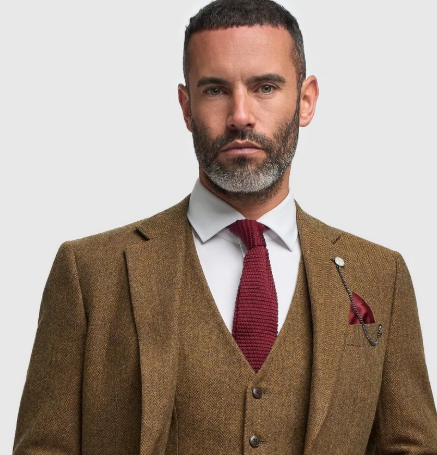 A gentleman wearing a three-piece brown suit from the House of Cavani sale section