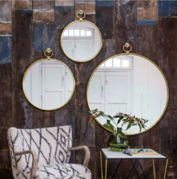 Antiqued gold pendant mirrors from the Graham and Green mirrors section.