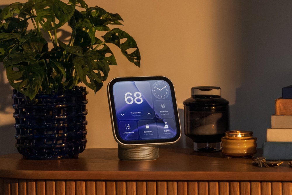 An Apple HomeView set up on a dark wood console table