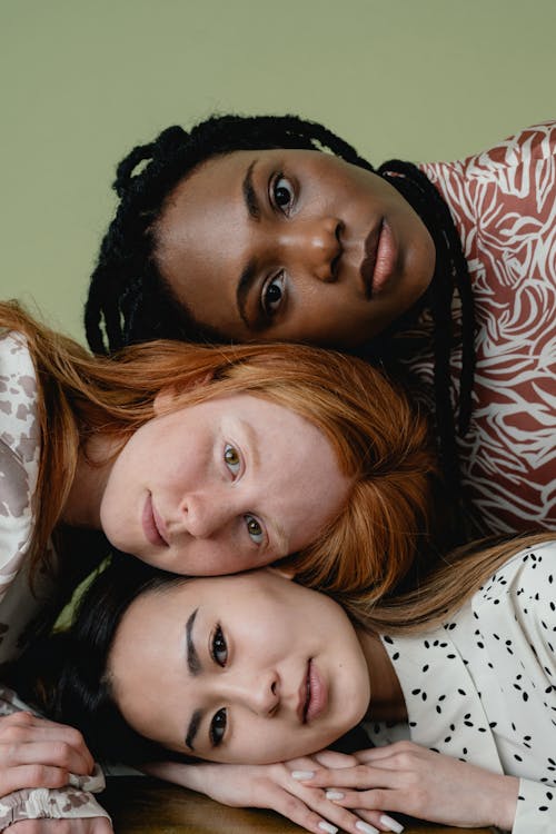 Three women posing for a photoshot.