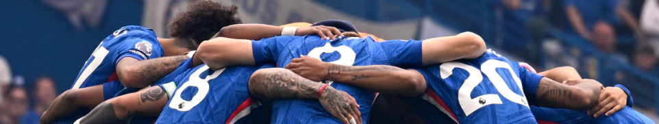 The Chelsea football team huddled together